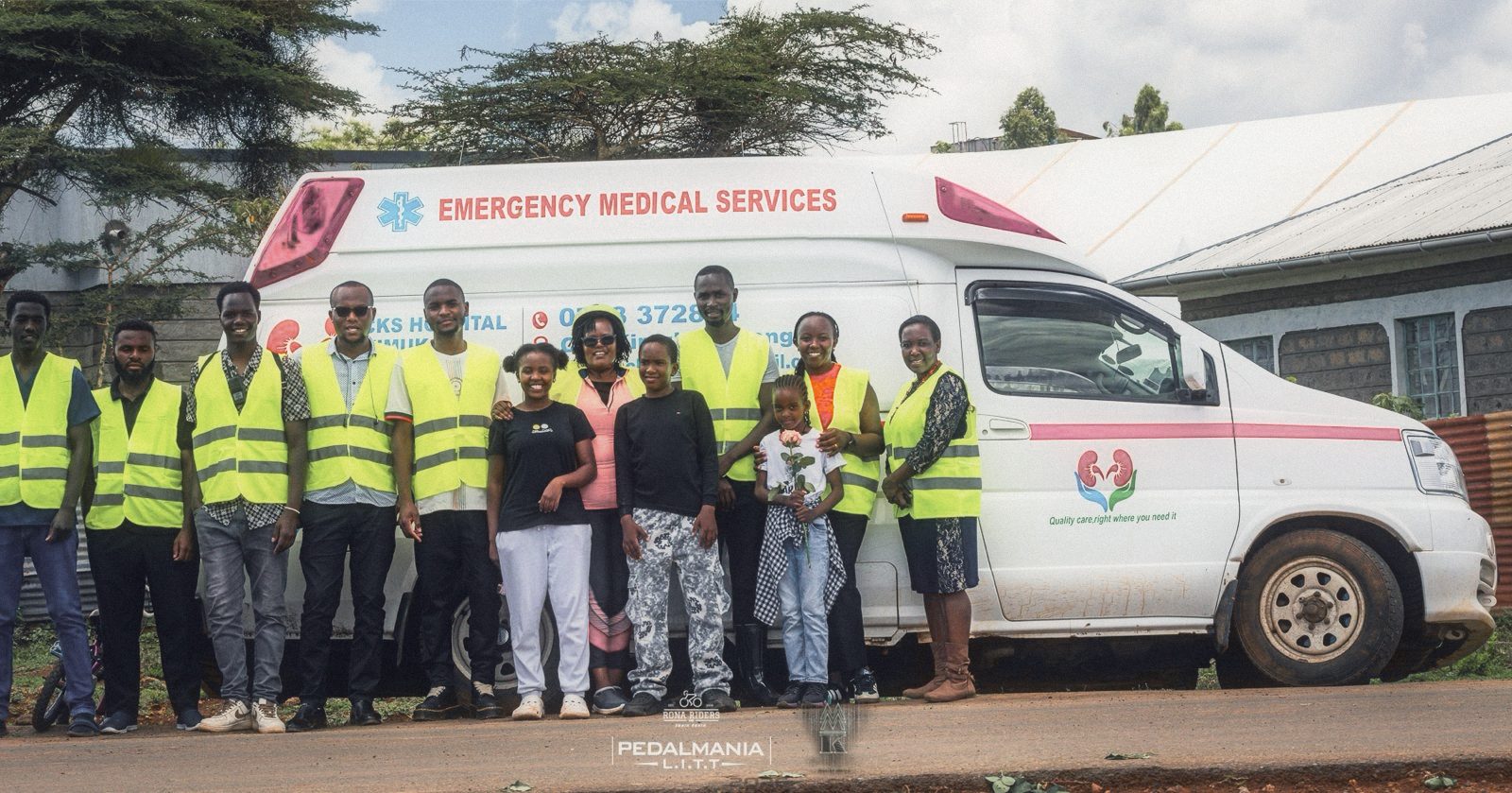 CKS emergency team in high-visibility vests beside the hospital ambulance